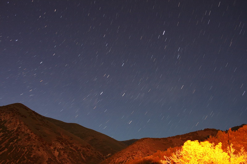 Star trails in the night sky over a mountain